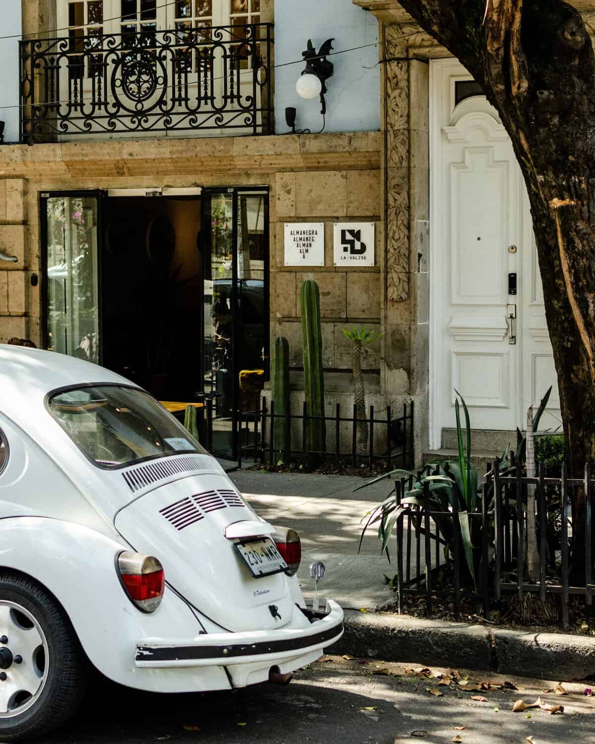 the exterior building of La Valise next to a volkswagon beatle bug 